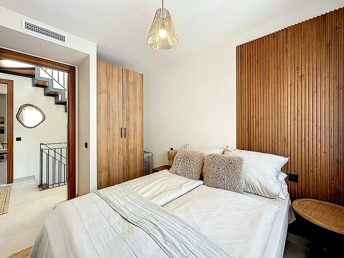 Master bedroom with panelled wall