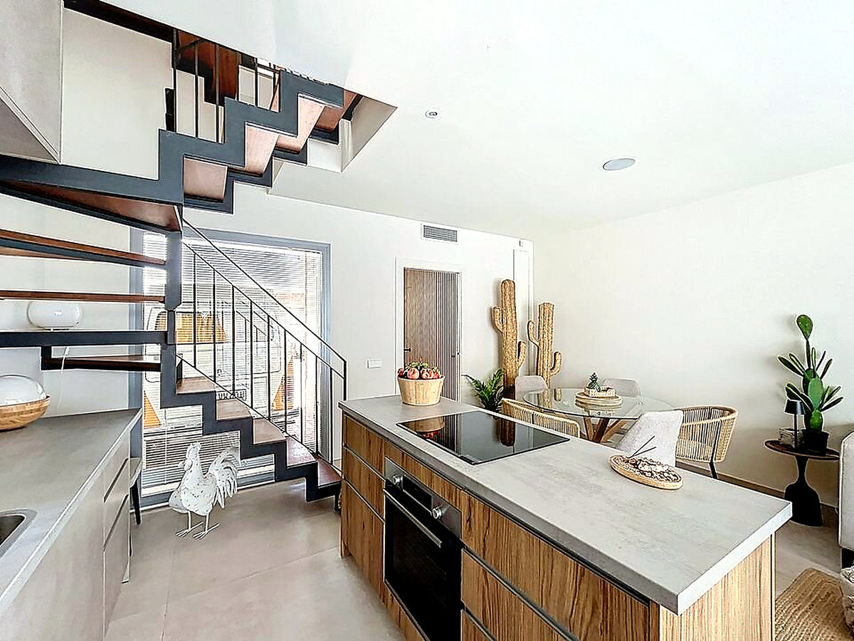 Kitchen with island and open staircase